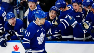 Toronto Maple Leafs' Max Domi (11) celebrates his goal against the New York Rangers during shootout NHL hockey action in Toronto on Saturday, March 2, 2024. THE CANADIAN PRESS/Frank Gunn