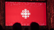 The CBC logo is projected onto a screen in Toronto on May 29, 2019. (Tijana Martin / The Canadian Press) 