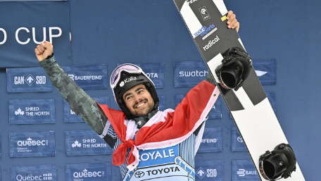 Canada's Eliot Grondin, of Sainte-Marie, Que., celebrates his third place finish, at the FIS snowboard cross world cup event at Mont-Sainte-Anne resort in Beaupre, Que., Sunday, March 26, 2023. THE CANADIAN PRESS/Jacques Boissinot