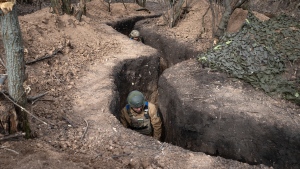Ukrainian servicemen of the 28th Separate Mechanised Brigade take their position in a trench at the front line, near Bakhmut, Donetsk region, Ukraine, Sunday, March 3, 2024. (AP Photo/Efrem Lukatsky)