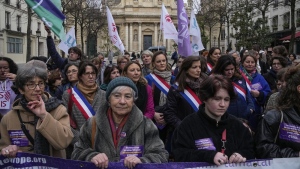 Pro-abortion rights activists attend a rally outside La Sorbonne university in Paris, Wednesday Feb. 28, 2024. France's Senate is voting on a bill meant to enshrine a woman's right to an abortion in the French Constitution. (AP Photo/Michel Euler)