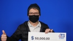 Kan-Fu Wong with his Lotto 6/49 prize cheque. (OLG)