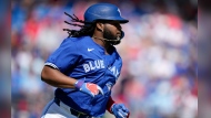 Toronto Blue Jays' Vladimir Guerrero Jr. watches a fly ball in the fourth inning of a spring training baseball game against the Philadelphia Phillies Monday, March 4, 2024, in Dunedin, Fla. THE CANADIAN PRESS/AP, Charlie Neibergall