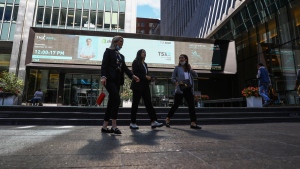 The Canadian Chamber of Commerce says women leaders in the corporate world still face barriers, with significant gaps in business ownership, representation and compensation. Women walk in the financial district in Toronto on Wednesday, September 29, 2021. THE CANADIAN PRESS/Evan Buhler