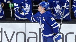 Toronto Maple Leafs right wing Mitchell Marner (16) celebrates with teammates after scoring in the second period of an NHL hockey game against the Boston Bruins, Thursday, March 7, 2024, in Boston. (AP Photo/Steven Senne)