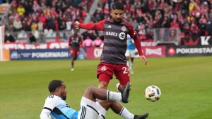 Charlotte FC's Nathan Byrne, left, tackles Toronto FC's Lorenzo Insigne during first half MLS action in Toronto, Saturday, March 9, 2024. THE CANADIAN PRESS/Chris Young