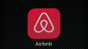 FILE - The Airbnb app icon is displayed on an iPad screen in Washington, D.C., on May 8, 2021. Airbnb says it’s banning the use of indoor security cameras in listings around the world by the end of next month. The San Francisco-based online rental platform said it making the change to simplify its security camera policy and continue efforts to prioritize privacy. (AP Photo/Patrick Semansky, File)