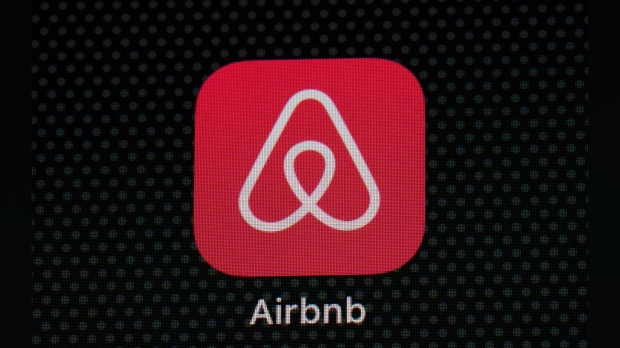 FILE - The Airbnb app icon is displayed on an iPad screen in Washington, D.C., on May 8, 2021. Airbnb says it’s banning the use of indoor security cameras in listings around the world by the end of next month. The San Francisco-based online rental platform said it making the change to simplify its security camera policy and continue efforts to prioritize privacy. (AP Photo/Patrick Semansky, File)
