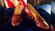 FILE - Ruby slippers once worn by Judy Garland in the "The Wizard of Oz," are displayed at a news conference, Sept. 4, 2018, at the FBI office in Brooklyn Center, Minn. A second man has been charged in connection with the 2005 theft of a pair of the ruby slippers, according to an indictment unsealed Sunday, March 17, 2024. (AP Photo/Jeff Baenen, File)