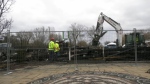 Equipment is used to sort through the wreckage of the clubhouse on Ward's Island Monday March 18, 2024 following a fire a day earlier. 