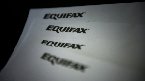 A new report suggests credit delinquencies among Canadian businesses are on the rise. Equifax logos are shown on paper in Toronto on Oct.17, 2019. THE CANADIAN PRESS/Christopher Katsarov
