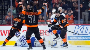 Philadelphia Flyers' Scott Laughton (21) celebrates after scoring a goal against Toronto Maple Leafs' Ilya Samsonov (35) during the third period of an NHL hockey game, Tuesday, March 19, 2024, in Philadelphia. (AP Photo/Matt Slocum)