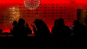 People are silhouetted as they sit in a restaurant having a drink during the COVID-19 pandemic in Toronto on Wednesday, March 30, 2022. The COVID-19 pandemic plus economic stressors are taking a toll on the mental health of Canadian adults, according to new data released by the Canadian Institute for Health Information on Thursday. THE CANADIAN PRESS/Nathan Denette