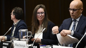 Environmental Defence Canada's Cassie Barker, centre, concludes an appearance at the Standing Committee on Environment and Sustainable Development in Ottawa, on Thursday, March 21, 2024. THE CANADIAN PRESS/Justin Tang