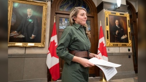 Minister of Foreign Affairs Melanie Joly makes her way to the podium in the Foyer of the House of Commons, Tuesday, December 12, 2023 in Ottawa. Joly says Canada welcomes a call from the UN Security Council calling for a ceasefire in the war between Israel and Hamas during the Muslim holy month of Ramadan. THE CANADIAN PRESS/Adrian Wyld