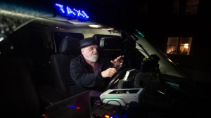Harold Butler plays the spoons in his Bugden's cab in St. John's, Newfoundland, on Thursday, March 21, 2024. The cabbie has auditioned for Canada's Got Talent. THE CANADIAN PRESS/Paul Daly
