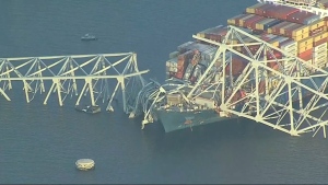 Parts of the Francis Scott Key Bridge remain after a container ship collided with a support Tuesday, March 26, 2024 in Baltimore. (WJLA via AP)
