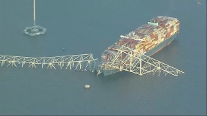 Parts of the Francis Scott Key Bridge remain after a container ship collided with a support Tuesday, March 26, 2024 in Baltimore. (WJLA via AP)