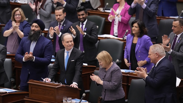 Minister of Finance Peter Bethlenfalvy receives a standing ovation from party members as he rises to table the Ontario provincial budget at the legislature at Queen's Park in Toronto on Tuesday, March 26, 2024. THE CANADIAN PRESS/Nathan Denette