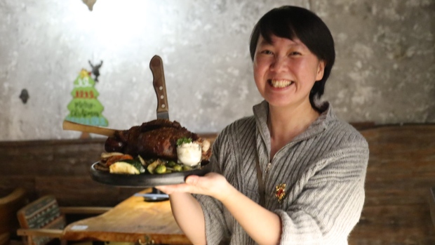 Hong Dai with Wood House BBQ poses in a photo at the restaurant in North York. 
