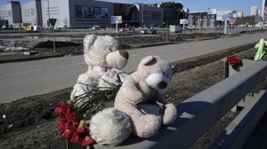 Toys and flowers lie in front of the Crocus City Hall on the western outskirts of Moscow, Russia, Wednesday, March 27, 2024. (Alexander Zemlianichenko/AP Photo)