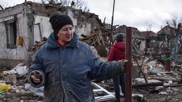 Inna, 71, stands outside of her house which was destroyed by a Russian drone attack in a residential neighbourhood, in Zaporizhzhia, Ukraine, on Thursday, March 28, 2024. (AP Photo/Andriy Andriyenko)