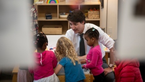 Prime Minster Justin Trudeau chats with children in child care at Don Christian Recreation Centre in Surrey, B.C on Thursday, March 28, 2024. 