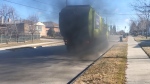 A Toronto city councillor is calling this privately owned GFL garbage truck "unacceptable" after seeing it drive around belching black smoke in a video taken on March 28, 2024. (Jon Woodward / CTV News)