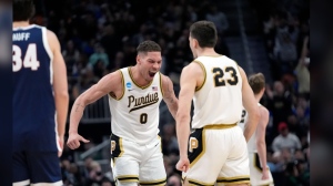 Purdue forward Mason Gillis (0) reacts with forward Camden Heide (23) after a play during the second half of a Sweet 16 college basketball game against Gonzaga in the NCAA Tournament, Friday, March 29, 2024, in Detroit. (AP Photo/Paul Sancya)