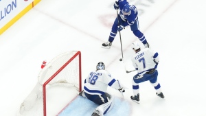 Tampa Bay Lightning goaltender Andrei Vasilevskiy (88) makes a save against Toronto Maple Leafs' Auston Matthews (34) as Lightning's Haydn Fleury (7) defends during third period NHL hockey action in Toronto on Wednesday, April 3, 2024. THE CANADIAN PRESS/Chris Young