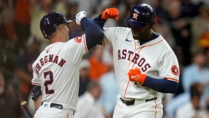 Houston Astros designated hitter Yordan Alvarez, right, celebrates with Alex Bregman after hitting a solo home run against the Toronto Blue Jays during the sixth inning of a baseball game Wednesday, April 3, 2024, in Houston. (AP Photo/Eric Christian Smith)