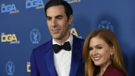FILE - Sacha Baron Cohen, left, and Isla Fisher arrive at the 71st annual DGA Awards at the Ray Dolby Ballroom on Saturday, Feb. 2, 2019, in Los Angeles. Cohen and Fisher say they filed for divorce last year after more than 20 years as a couple. (Photo by Chris Pizzello/Invision/AP, File)