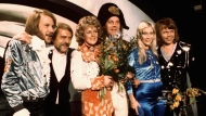 FILE - Members of Swedish group ABBA and close associates celebrate the victory of their song 