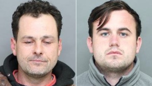 Police say the two men in the photo have been charged in connection with a roofing scam investigation. (Toronto Police Service)