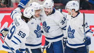 Toronto Maple Leafs' Auston Matthews (34) celebrates with teammates after scoring against the Montreal Canadiens during second period NHL hockey action in Montreal, Saturday, April 6, 2024. THE CANADIAN PRESS/Graham Hughes