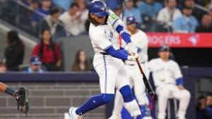 Toronto Blue Jays' Bo Bichette (11) hits a two-run home run against the Seattle Mariners during third inning American League MLB baseball action in Toronto on Tuesday, April 9, 2024. THE CANADIAN PRESS/Chris Young