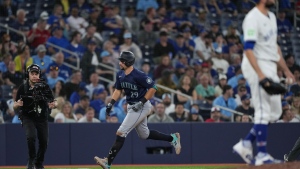 Seattle Mariners' Cal Raleigh (29) rounds the bases past Toronto Blue Jays pitcher Tim Mayza (58) after hitting the game-winning two-run home run during tenth inning American League MLB baseball action in Toronto on Wednesday, April 10, 2024. THE CANADIAN PRESS/Nathan Denette