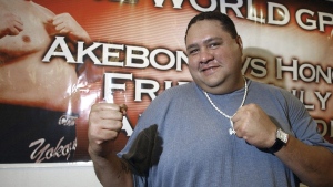 Akebono poses for a photo during a news conference at Aloha Stadium in Honolulu, Tuesday, July 26, 2005. Hawaii-born Akebono, one of the greats of sumo wresting and a former grand champion, is reported to have died earlier this month of heart failure while receiving care at a hospital in Tokyo, the United States Forces in Japan said in a statement on Thursday, April 11, 2024. (AP Photo /Lucy Pemoni, File)