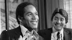 FILE - In this March 24, 1978 file photo, O.J. Simpson, left, smiles next to San Francisco 49ers owner Edward DeBartolo Jr. at a news conference where the 49ers announced that Simpson had been traded to them from the Buffalo Bills, in San Francisco. (AP Photo/Sal Veder, file)