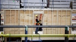An employee works on a modular home component at NRB Modular Solutions in Calgary, Friday, April 5, 2024. The Canadian government will allow 30-year amortization periods on insured mortgages for first-time homebuyers purchasing newly built homes. THE CANADIAN PRESS/Jeff McIntosh
