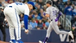 Toronto Blue Jays pitcher Paolo Espino reacts as Colorado Rockies left fielder Nolan Jones (22) rounds the bases on his solo homer in fifth inning interleague MLB action on Friday April 12, 2024. THE CANADIAN PRESS/Frank Gunn