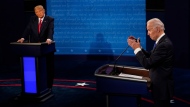 Democratic presidential candidate former Vice President Joe Biden, right, answers a question as President Donald Trump listens during the second and final presidential debate Oct. 22, 2020, in Nashville, Tenn. (AP Photo/Morry Gash, Pool, File)