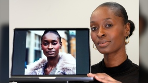 Fashion model Alexsandrah poses with a computer showing an AI generated image of her, in London, Friday, March 29, 2024. The use of computer-generated supermodels has complicated implications for diversity. Although AI modeling agencies -- some of them Black-owned -- can render models of all races, genders and sizes at the click of a finger, real models of color who have historically faced higher barriers to entry may be put out of work. (AP Photo/Kirsty Wigglesworth)