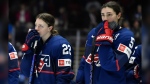 United States forward Tessa Janecke, left, and defensewoman Megan Keller react as they watch Canada celebrate their win in the final at the IIHF Women's World Hockey Championships in Utica, N.Y., Sunday, April 14, 2024. (AP Photo/Adrian Kraus)