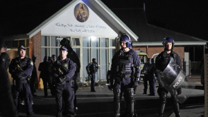 Security officers stand guard outside Orthodox Assyrian church in Sydney, Australia, Monday, April 15, 2024. (AP Photo/Mark Baker)