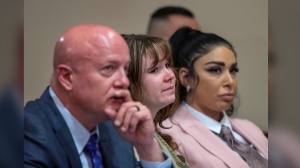 Hannah Gutierrez Reed, center, with her attorney Jason Bowles and paralegal Carmella Sisneros during her sentencing hearing in state district court in Santa Fe, New Mexico, on Monday, April 15, 2024. Reed, the armorer on the set of the Western film "Rust," was sentenced to 18 months in prison for involuntary manslaughter in the death of cinematographer Halyna Hutchins, who was fatally shot by Alec Baldwin in 2021. (Eddie Moore/The Albuquerque Journal via AP, Pool)