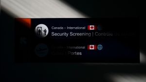 The Federal Court of Appeal says people can be barred from Canada under espionage-related provisions of the immigration law only when their activities have a clear link to Canada's security. A security sign is pictured at the Ottawa International Airport in Ottawa on Wednesday, May 10, 2023. THE CANADIAN PRESS/Sean Kilpatrick