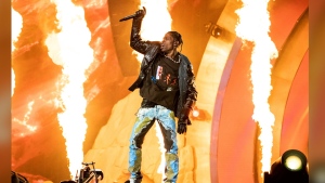 FILE - Travis Scott performs at the Astroworld Music Festival in Houston, Nov. 5, 2021. A judge in Texas is expected hear arguments Monday, April 15 2024, in Scott's request to be dismissed from a lawsuit over the deadly 2021 Astroworld festival. (Photo by Amy Harris/Invision/AP, File)