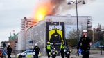 Fire and smoke rise out of the Old Stock Exchange, Boersen, in Copenhagen, Denmark, Tuesday April 16, 2024ю (Ida Marie Odgaard/Ritzau Scanpix via AP)