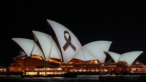 The Sydney Opera House is illuminated with a black ribbon Monday, April 15, 2024, as part of the national day of mourning following the stabbing deaths of several people at a shopping mall on April 13. (AP Photo/Mark Baker)